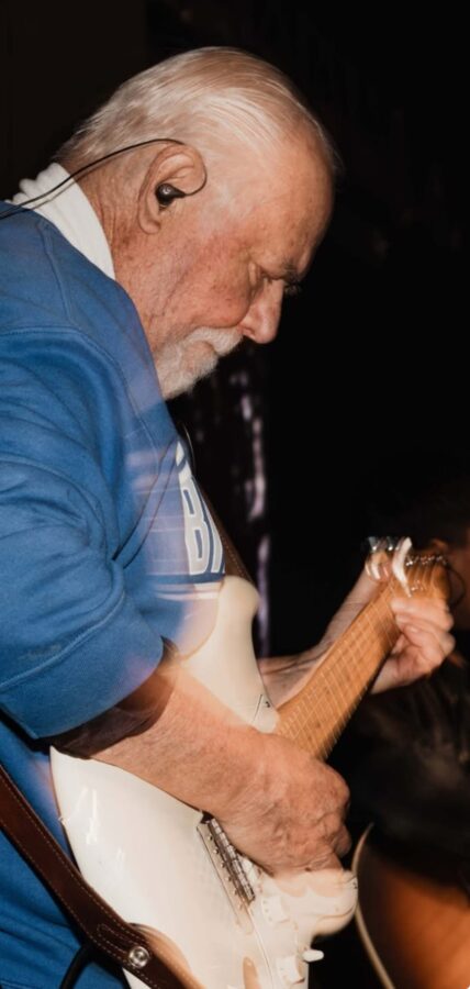 Pat playing guitar closeup